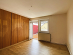 Wohnzimmer mit Ausgang zum Balkon - Raumwunder in Dransfeld